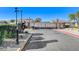 Gated community entrance with landscaping at 1002 Harp Way, North Las Vegas, NV 89032