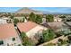 Aerial view of a house with a tile roof and a landscaped backyard at 10221 Crystal Arch Ave, Las Vegas, NV 89129