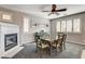 Dining area with table, chairs, and fireplace at 10221 Crystal Arch Ave, Las Vegas, NV 89129