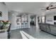 Kitchen with breakfast bar and view into the living room at 10437 Lyric Arbor Dr, Las Vegas, NV 89135