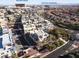 Aerial view of the modern townhome community with views of Red Rock Resort and Downtown Summerlin at 11431 Gravitation Dr # 102, Las Vegas, NV 89135