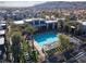 An aerial view of the community pool, showcasing its modern design and relation to surrounding residences at 11431 Gravitation Dr # 102, Las Vegas, NV 89135