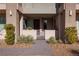 Inviting townhome entrance with a paved walkway and desert landscaping at 11431 Gravitation Dr # 102, Las Vegas, NV 89135