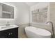 Bathroom boasts a freestanding tub and modern vanity at 1835 Candle Bright Dr, Henderson, NV 89074