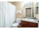 Bathroom featuring a shower with a curtain, modern vanity, and toilet at 2120 Ramrod Ave # 1112, Henderson, NV 89014