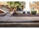 Building exterior with stairway, desert landscaping, and AC units at 2120 Ramrod Ave # 1112, Henderson, NV 89014