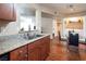 Kitchen area with updated countertops and a dining nook with convenient laundry area at 2120 Ramrod Ave # 1112, Henderson, NV 89014