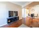 Open living space with sleek furniture and rich wood flooring, creating a warm atmosphere at 2120 Ramrod Ave # 1112, Henderson, NV 89014