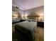 Cozy bedroom featuring a queen bed, mirrored closet, and bedside tables with lamps for a warm and inviting atmosphere at 230 E Flamingo Rd # 212, Las Vegas, NV 89169