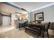 Inviting dining area with a wooden table and bench seating, adjacent to the kitchen for easy entertaining at 230 E Flamingo Rd # 212, Las Vegas, NV 89169