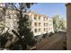 Low-rise building shows balconies and walkways in a clean landscape. Decorative elements and greenery add to curb appeal at 230 E Flamingo Rd # 212, Las Vegas, NV 89169