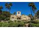 Well-maintained, luxury home featuring desert landscaping, a unique architectural design, and a tile roof at 230 E Flamingo Rd # 212, Las Vegas, NV 89169
