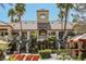 Beautiful building exterior showcasing elegant architecture, palm trees, and a meticulously landscaped entrance with stairs at 230 E Flamingo Rd # 212, Las Vegas, NV 89169