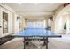 Community game room featuring a JOOLA ping pong table and comfortable seating areas at 230 E Flamingo Rd # 212, Las Vegas, NV 89169