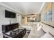 Comfortable living room with a large sectional sofa and view into the dining area, perfect for relaxing and entertaining at 230 E Flamingo Rd # 212, Las Vegas, NV 89169