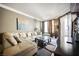 Spacious living room featuring a plush sectional sofa, a coffee table, and large windows for natural light at 230 E Flamingo Rd # 212, Las Vegas, NV 89169
