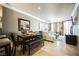 Open-concept living space with a dining area and a plush sectional sofa, perfect for entertaining or relaxing at 230 E Flamingo Rd # 212, Las Vegas, NV 89169