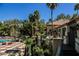 Resort-style pool area with ample lounge chairs, lush landscaping, and privacy for relaxation and recreation at 230 E Flamingo Rd # 212, Las Vegas, NV 89169