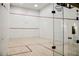 Bright squash court featuring hardwood floors, clear glass doors, and a regulation-sized net for competitive play at 230 E Flamingo Rd # 212, Las Vegas, NV 89169