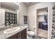 Bathroom featuring modern granite countertop and walk-in closet at 2657 Champagne Gold Ave, North Las Vegas, NV 89086
