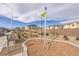 View of a community park with playground equipment and walking paths at 2657 Champagne Gold Ave, North Las Vegas, NV 89086