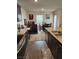 Well-lit kitchen with a view of the dining area and modern appliances at 2657 Champagne Gold Ave, North Las Vegas, NV 89086