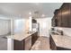 Modern kitchen with granite countertops and stainless steel appliances at 2657 Champagne Gold Ave, North Las Vegas, NV 89086