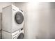 Efficient laundry area with modern, stacked washer and dryer units at 2657 Champagne Gold Ave, North Las Vegas, NV 89086