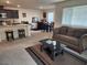 Spacious living area offering a cozy seating arrangement and bright natural light at 2657 Champagne Gold Ave, North Las Vegas, NV 89086