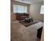 Inviting living room featuring a plush sofa and a stylish glass-top coffee table at 2657 Champagne Gold Ave, North Las Vegas, NV 89086