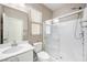 Clean bathroom with walk-in shower and white vanity at 3094 Isle Dr, Las Vegas, NV 89141
