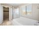 Bathroom with soaking tub, walk-in shower, and closet at 3094 Isle Dr, Las Vegas, NV 89141