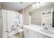 Clean bathroom with white vanity and shower/tub combo at 3094 Isle Dr, Las Vegas, NV 89141