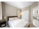 Well-lit bedroom with double closet and view of hallway at 3094 Isle Dr, Las Vegas, NV 89141