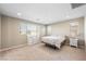 Bright bedroom with carpeted floor, window, and dresser at 3094 Isle Dr, Las Vegas, NV 89141
