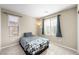 Bedroom with double bed, window, and neutral decor at 3094 Isle Dr, Las Vegas, NV 89141