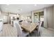 Elegant dining area with stone table and chairs, adjacent to the kitchen at 3094 Isle Dr, Las Vegas, NV 89141