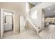 Bright entryway with tile floors, half bathroom, and staircase at 3094 Isle Dr, Las Vegas, NV 89141