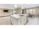 Open kitchen with island, breakfast bar and view of living room at 3094 Isle Dr, Las Vegas, NV 89141