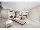 Spacious living room with L-shaped sofa and view of kitchen at 3094 Isle Dr, Las Vegas, NV 89141
