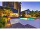 Expansive backyard with a sparkling pool, lush landscaping, and elegant outdoor living spaces perfect for entertaining at 3146 Bel Air Dr, Las Vegas, NV 89109