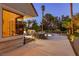 Inviting backyard featuring a dining table, lush greenery, and a glimpse of a refreshing pool at 3146 Bel Air Dr, Las Vegas, NV 89109