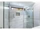 Luxurious bathroom with a glass-enclosed shower and tiled walls at 3146 Bel Air Dr, Las Vegas, NV 89109