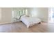 Bright bedroom featuring mirrored wall and wood-look floors at 3146 Bel Air Dr, Las Vegas, NV 89109