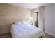 Bedroom featuring a wood accent wall and access to a private outdoor space at 3146 Bel Air Dr, Las Vegas, NV 89109