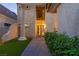 Elegant home entrance with a stately column, lush greenery, and a welcoming walkway leading to the front door at 3146 Bel Air Dr, Las Vegas, NV 89109