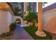 Beautiful home featuring a classic archway, lush greenery, and a charming walkway leading to the inviting entrance at 3146 Bel Air Dr, Las Vegas, NV 89109
