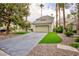 Charming single-Gathering home with a two-car garage, concrete driveway, and mature trees at 3146 Bel Air Dr, Las Vegas, NV 89109