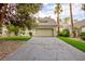 Charming single-Gathering home with a two-car garage, concrete driveway, and mature trees at 3146 Bel Air Dr, Las Vegas, NV 89109