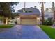 Elegant home showcasing an attached garage, lush green accents, and a welcoming driveway at 3146 Bel Air Dr, Las Vegas, NV 89109